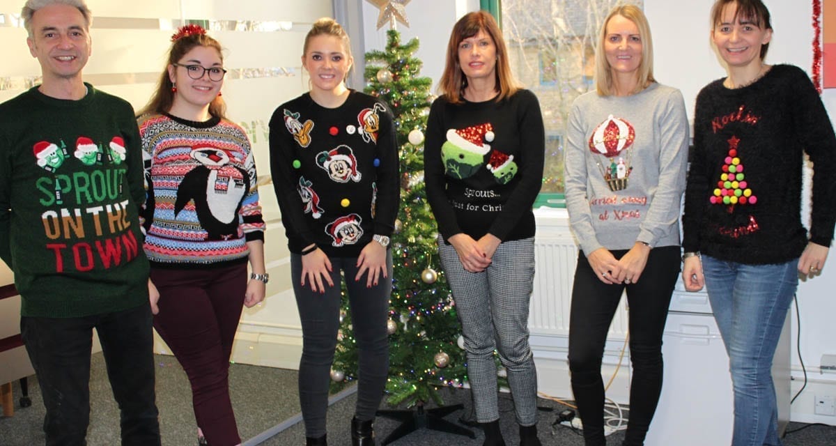 The team gets festive with Christmas jumpers!