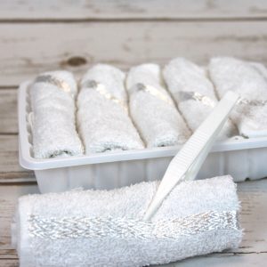 Cold or hot towel set in tray with tweezers