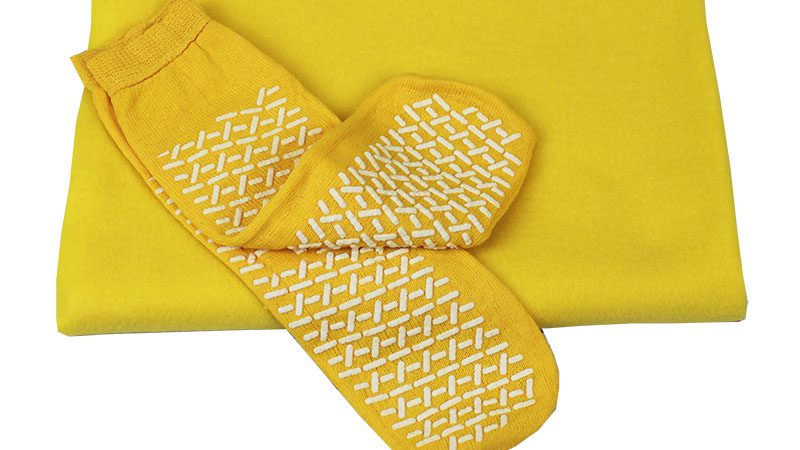 Fall prevention socks and matching yellow blanket